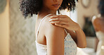 Shoulder, hand and woman with cream for skincare, sunscreen and product for morning routine. Body lotion, cosmetics and person apply moisturizer for hydration, beauty and dermatology in home bathroom