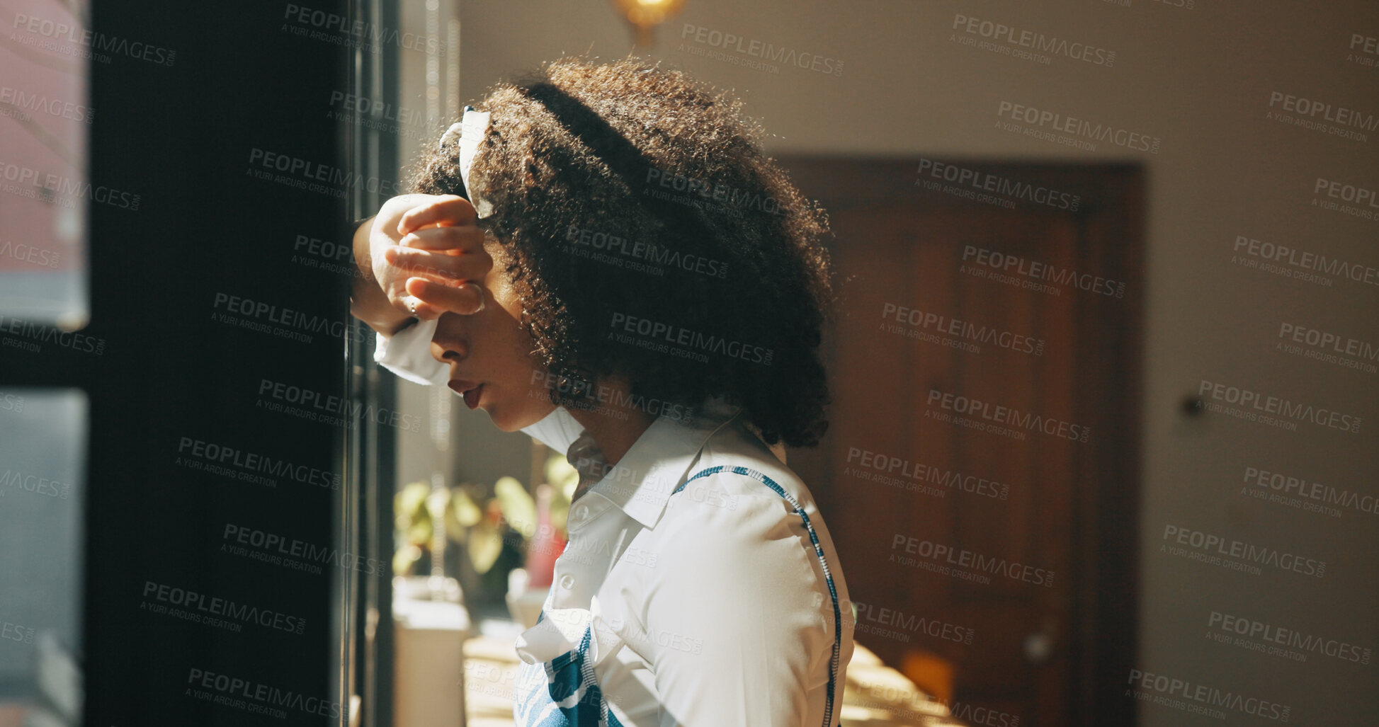 Buy stock photo African woman, window and regret in home with headache, mistake or anxiety with reflection for decision. Person, sad and thinking for perspective, loss or grief with mental health in morning at house