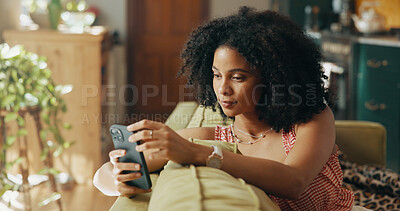 Buy stock photo Phone, relax and African woman on sofa in home for social media, networking and communication. Apartment, living room and person on smartphone for online chatting, internet post or website on weekend