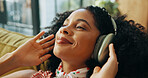 Relax, music and happy woman with headphones in home, streaming podcast and think of subscription. Living room, audio technology and African person listening to radio, reflection or idea for playlist