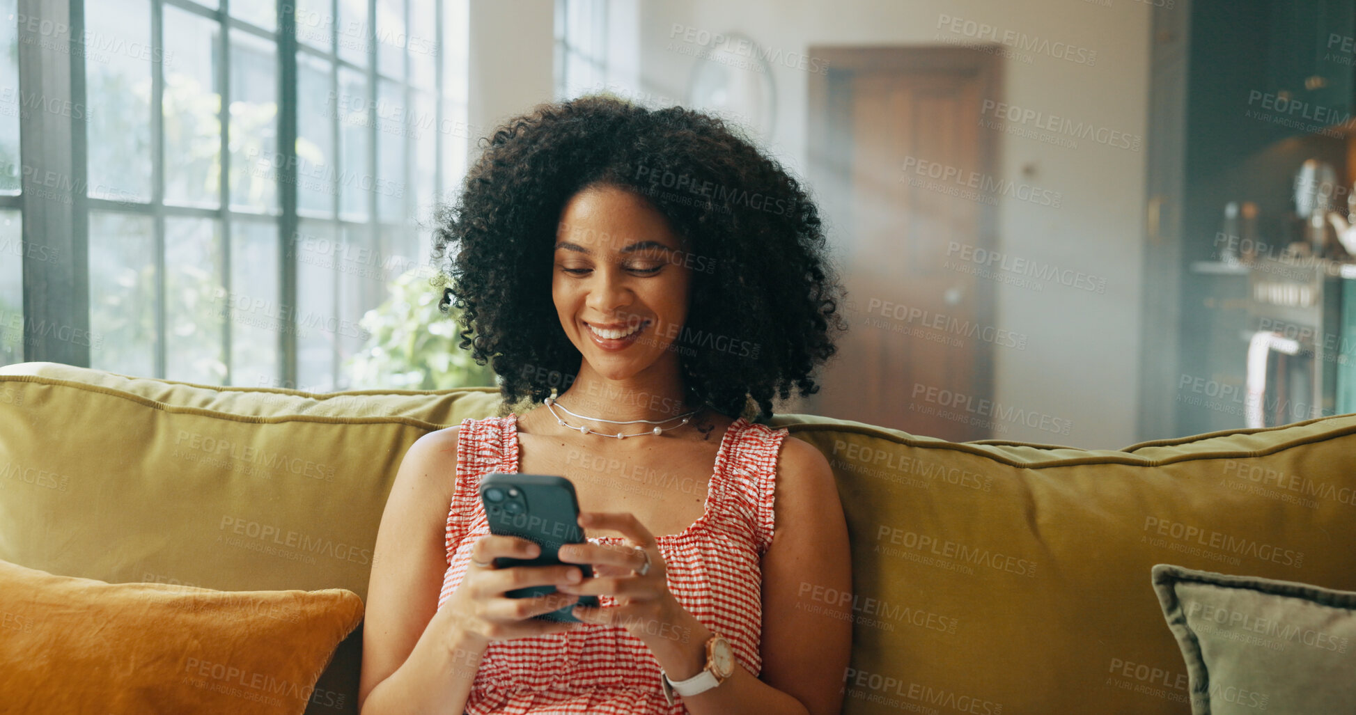 Buy stock photo Happy, relax and woman on sofa with phone in home for social media, networking and communication. Apartment, living room and African person on smartphone for online chatting, internet post or website
