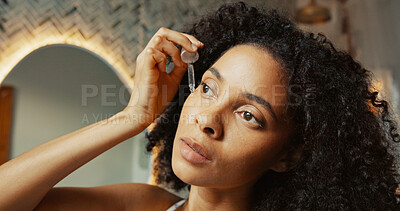 Buy stock photo Serum, skincare and vitamin c with woman in bathroom for glow facial, cosmetics and beauty. Dermatology, self care product and face treatment with person at home for oil dropper, shine and grooming
