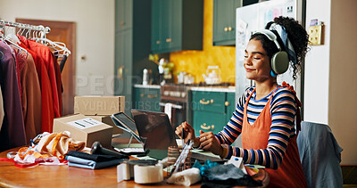 Buy stock photo Fashion designer, laptop and woman in home with headphones for music, podcast and radio. Small business, creative and person on computer for dancing, textile order and clothing retailer startup