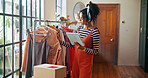 Woman, tablet and clothes inspection of small business for stock check, quality control and checklist. Person, collection and digital for fashion ecommerce, inventory management and schedule delivery