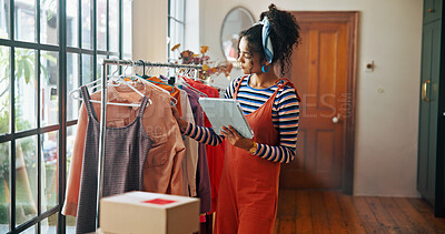Buy stock photo Woman, tablet and clothes inspection of small business for stock check, quality control and checklist. Person, collection and digital for fashion ecommerce, inventory management and schedule delivery