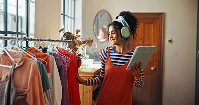 Buy stock photo Woman, tablet and headphones for small business, ecommerce and fashion boutique startup with online sales. Designer, technology and website for internet store, retail service and quality control