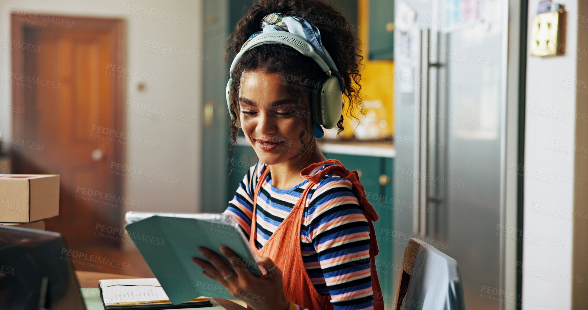 Buy stock photo Fashion designer, tablet and business woman in home with headphones for music, podcast and radio. Startup, creative and person on digital tech for ecommerce, textile order and clothing retailer