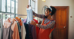 Smile, woman and phone call for fashion small business, courier service and schedule delivery. Person, mobile and clothes for stock check, online order and inventory management for feedback of choice