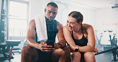 Buy stock photo Phone, laughing and people on break in gym to check social media, fitness app or comedy. Bodybuilding tips, friends or athletes with mobile for reading funny joke, training meme or exercise routine