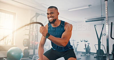 Buy stock photo Gym, exercise and black man with battle rope for muscle growth, strength development and power workout. Equipment, endurance and African bodybuilder with resilience in fitness, challenge or hard work