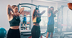 Workout, exercise and kettlebell with personal trainer, class and gym for training or fitness routine. Weightlifting, goals and target with group of sports people in health club together for muscle