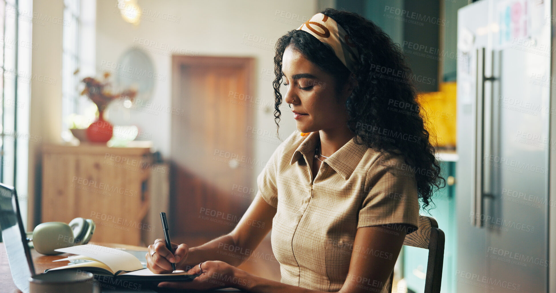 Buy stock photo Girl, student and writing notes with book in home for online course, e learning and study in morning. Woman, notebook and editing project by pc for education, scholarship and class on web in kitchen