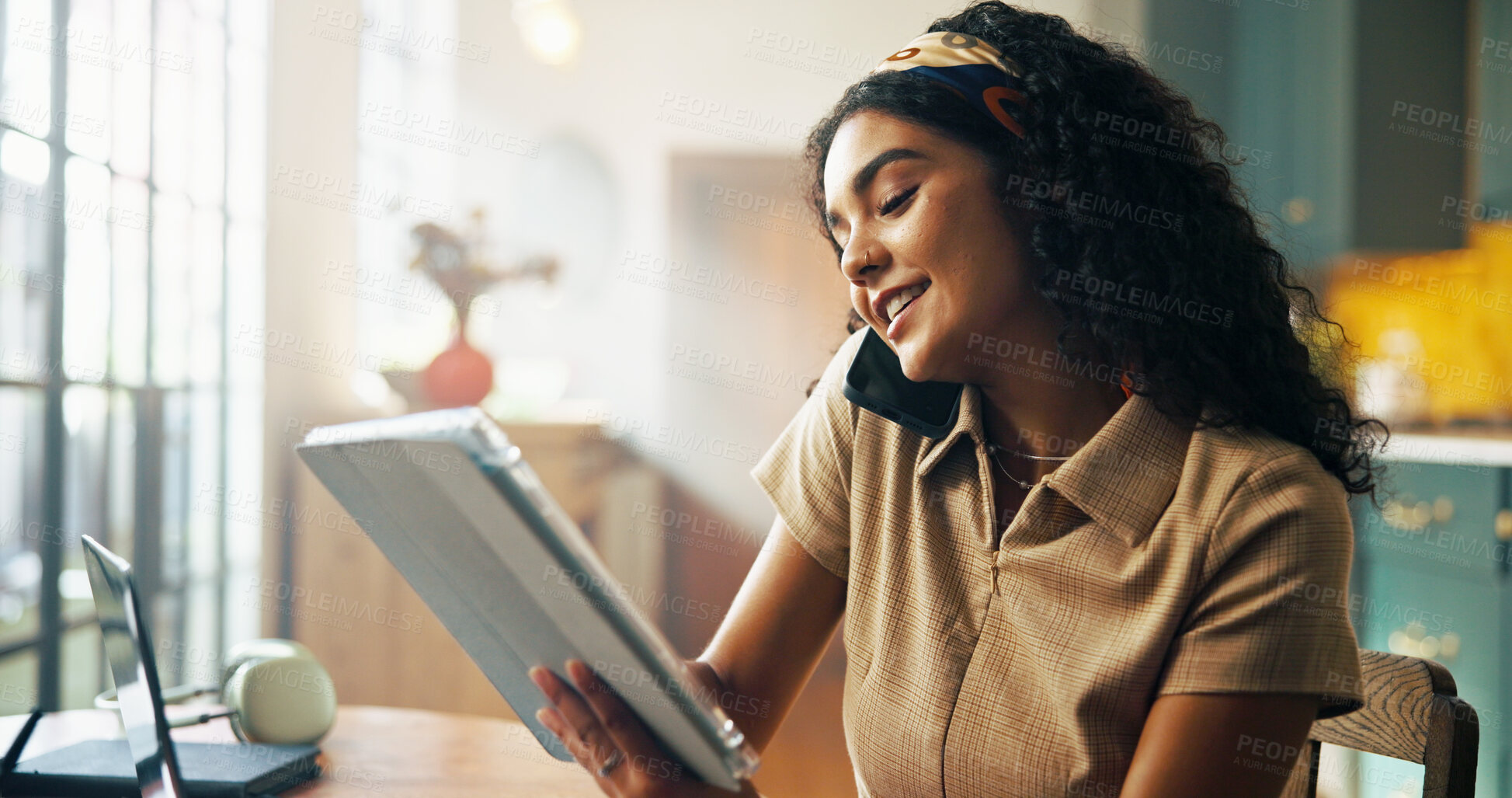 Buy stock photo Woman, phone call and tablet for remote work from home in kitchen for talk, solution or smile for review. Person, virtual assistant and happy on smartphone, app or check for notes, agenda or deadline