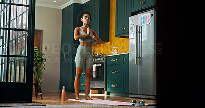 Buy stock photo Meditation, wellness and yoga with woman in kitchen of home for balance, health or holistic routine. Chakra, fitness and stress relief with yogi person in apartment for exercise or inner peace