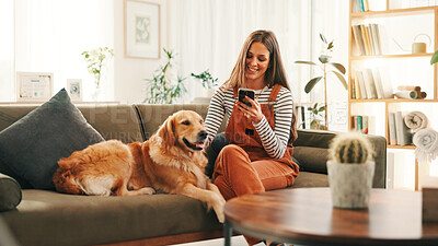Buy stock photo Smartphone, relax and woman on sofa with dog for bonding, reading or social media scroll at home on day off. Phone, smile and female person in living room with golden retriever, love and search