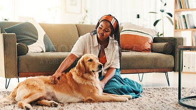 Buy stock photo Stroke, relax or black woman in living room with dog, support or companion in home with care or love. Animal adoption, affection or girl in house with golden retriever, best friend or pet for bonding