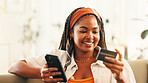 Smile, black woman and phone with credit card at house for payment, online shopping and bank information. Person. mobile and pin for financial transaction, ecommerce purchase and investment website