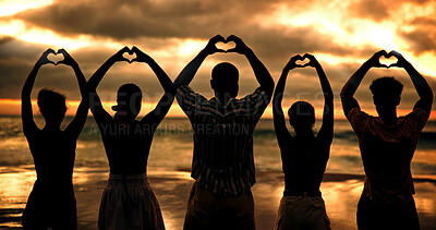 Buy stock photo Group, heart hands and people at sunset, beach and back with connection for love with silhouette by sea. Friends, together and community for symbol, sign or support with kindness on vacation by ocean