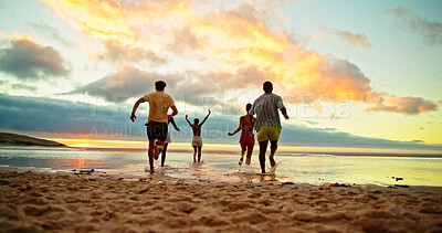 Buy stock photo Back view, running and friends in sea water for holiday, vacation and summer trip on tropical island. Group, ocean and people race by beach with energy for freedom, travel and adventure at sunset