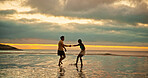 Couple, holding hands and playful fun on beach of travel date, sunset and bonding of summer holiday. People, walk and romance for vacation trip, tropical island and relationship commitment of getaway