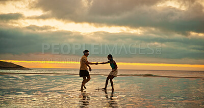 Buy stock photo Couple, holding hands and playful fun on beach of travel date, sunset and bonding of summer holiday. People, walk and romance for vacation trip, tropical island and relationship commitment of getaway
