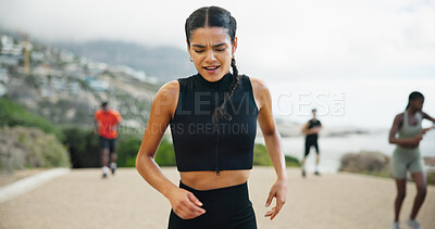 Buy stock photo Tired, running and woman in street, fitness and breathing with training, exercise and cramp with pain. People, runner and athlete with workout, outdoor and practice with health, wellness and cardio