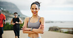 Portrait, woman and fitness with arms crossed outdoor for exercise, training and marathon practice. Confident, female person and morning routine with sports workout, physical performance and wellness