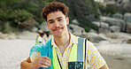 Cleaning, portrait and recycling with man on beach for community service or conservation. Charity, earth and smile of volunteer outdoor on coast for activism, social responsibility or sustainability