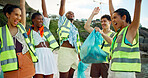 Happy people, volunteer and recycling with celebration on beach for climate change or global warming. Group, social worker or excited team with smile for winning, finished or community service by sea