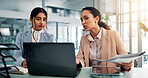 Meeting, laptop and business women with paperwork for financial review, budget report and planning. Professional, corporate and people with documents on computer for research, website and investment