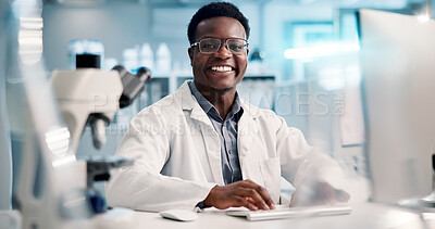 Buy stock photo Computer, black man and portrait of scientist typing in laboratory for medical research or discovery. Tech, science and African biologist with pharmaceutical report for futuristic genetic development