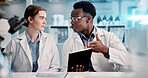 Tablet, scientist and team discussion for research results, healthcare innovation and test. Technology, medical science and collaboration with people in laboratory for planning chemistry experiment
