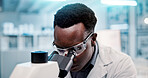 Microscope, black man and scientist in laboratory for research, discovery or project on medical organisms. Biotechnology, goggles and African biologist with equipment for DNA review for innovation.