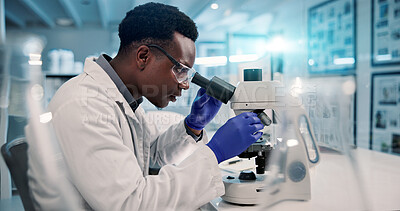 Buy stock photo Science, microscope and black man in laboratory for research, development or inspection. Vaccine analytics, medicine and scientist with equipment for medical study, innovation and biotech engineering