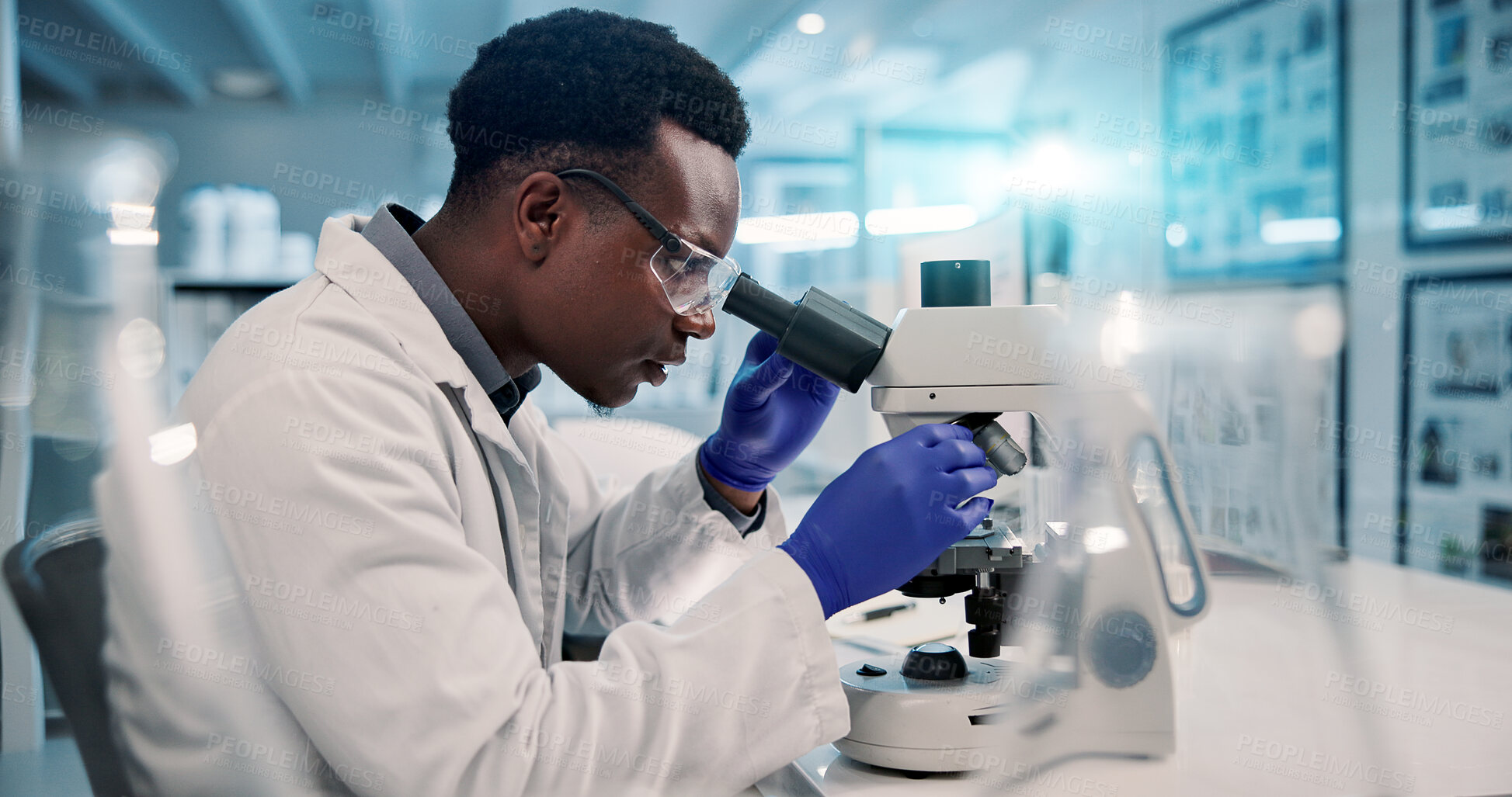 Buy stock photo Science, microscope and black man in laboratory for research, development or inspection. Vaccine analytics, medicine and scientist with equipment for medical study, innovation and biotech engineering