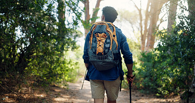 Buy stock photo Hiking, backpacking and back of man in nature for adventure, trekking and travel. Mountain, fitness and person walking with stick for wellness, fresh air and exercise to explore outdoor forest