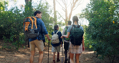 Buy stock photo Hiking, back and friends in nature walking for adventure, trekking and travel on holiday. Mountain, people and man and woman outdoors in conversation for wellness, fresh air and exercise to explore