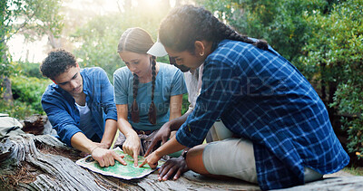 Buy stock photo Map, nature and group of friends hiking in forest with route plan for adventure together. Travel, outdoor and people with paper guide for trekking in woods on weekend trip for discovery or journey.