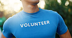 Man, volunteer and tshirt in nature for charity, community service or social responsibility. NGO management, person or representative outdoor with confidence, environment care or Earth day initiative