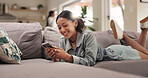 Home, funny and woman on sofa, smartphone and typing with smile, online humor and texting. Apartment, laughing or happy person with cellphone, joke or digital app for message to contact or internet