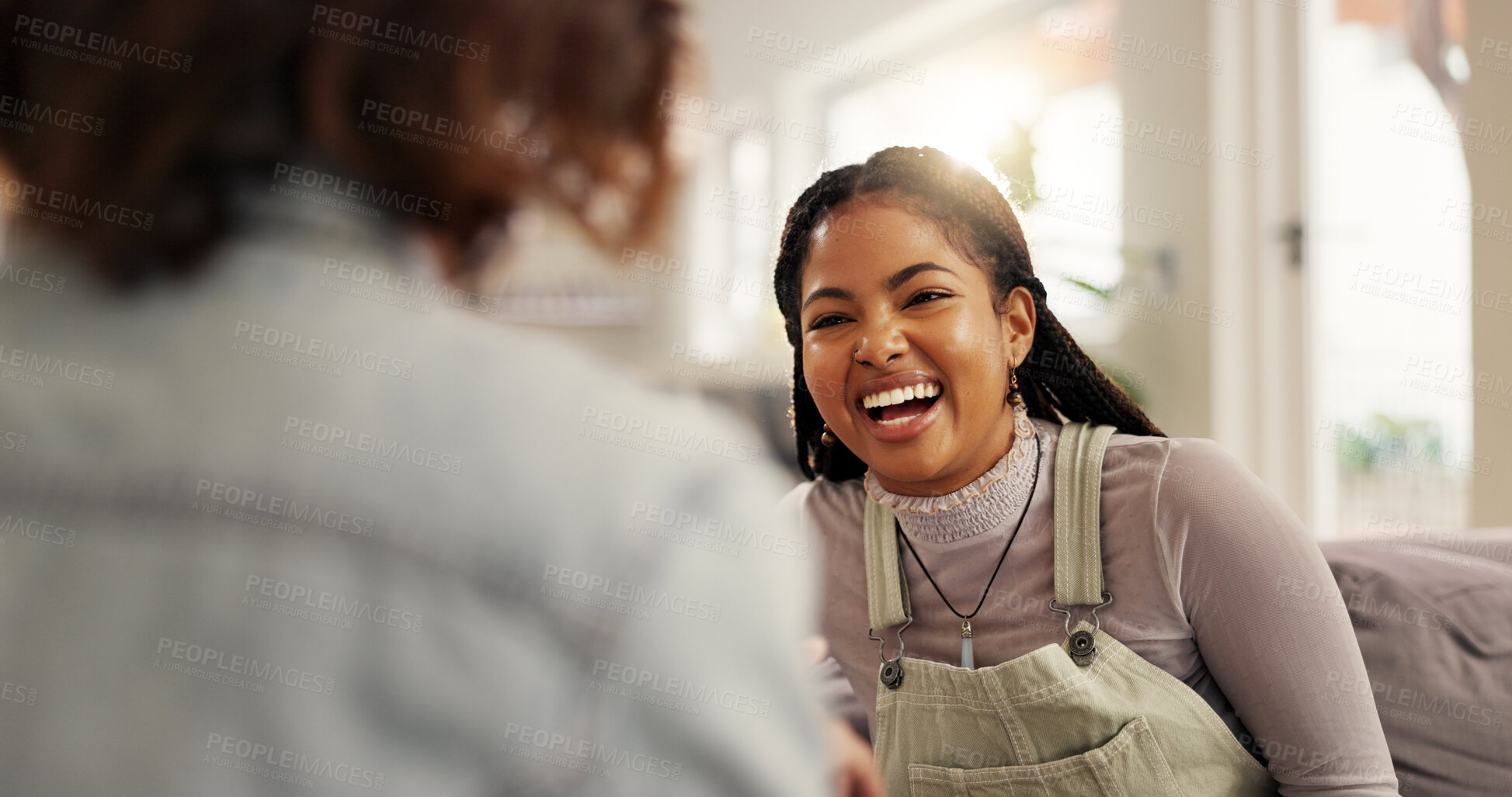 Buy stock photo Bonding, funny and woman friends on sofa in living room of home together for reunion or visit. Conversation, laughing and relax with people in apartment for gossip, relationship or social on weekend
