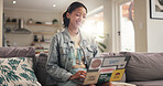 Home, student and teenager on couch, laptop and smile with education, email for project or assignment. Connection, college task or happy person with computer, university or research for scholarship