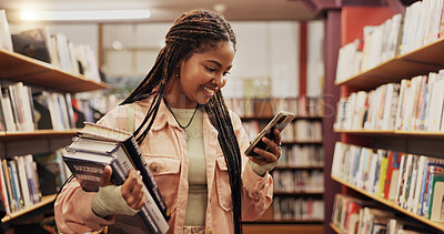 Buy stock photo Education, phone and student black woman in library to search for books or study material. App, learning and social media with happy person on college or university campus for school scholarship