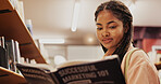 Black woman, reading and book as student in library for research, study marketing and career preparation. Person, textbook and information on business knowledge, education exam and university project