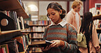 Woman, student and reading book in library for learning, studying and preparation for exam. Female person, textbook and search with information, university knowledge and wisdom for education thesis 