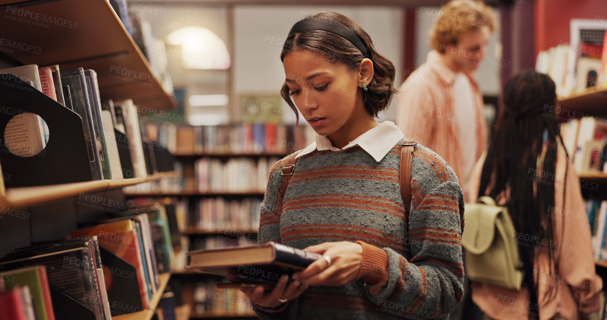Buy stock photo Woman, student and reading book in library for learning, studying and preparation for exam. Female person, textbook and search with information, university knowledge and wisdom for education thesis