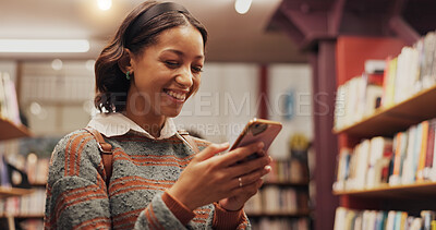 Buy stock photo Education, phone and student woman in library to search for books or study material. App, learning and social media with smile of happy person on college or university campus for school scholarship