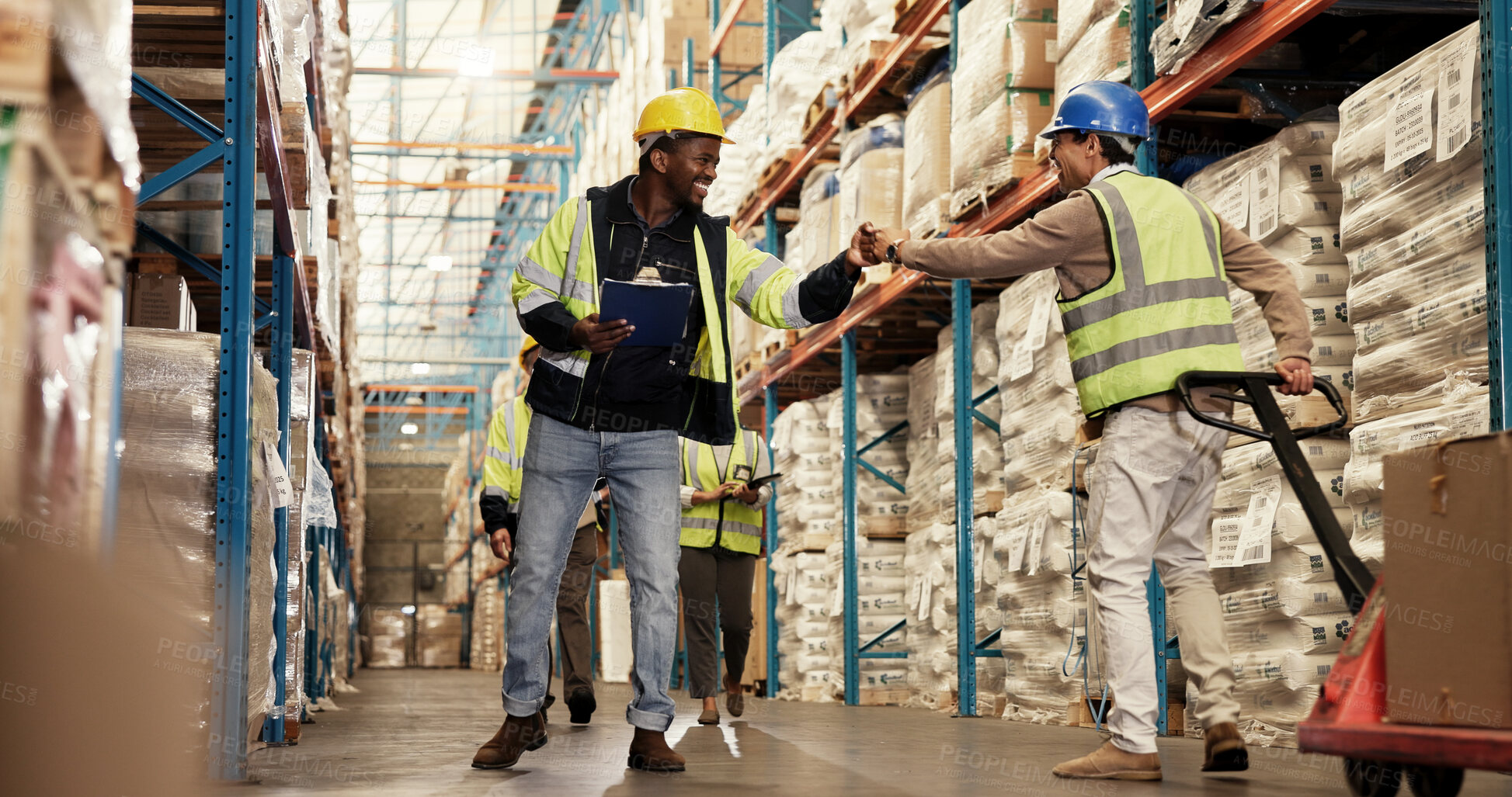 Buy stock photo Men, fist bump and teamwork at warehouse for logistics, clipboard and greeting by shelf, respect or inspection. People, happy and inventory for distribution, smile or supply chain at industrial plant