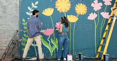 Buy stock photo Back, creative and couple painting on wall for art project, mural design and renovation of community. Happy, people and artist hobby for improvement, diy decoration and makeover for flowers aesthetic