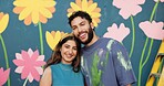 Mural, art and portrait of couple by wall for painting, creative project and decoration outdoors. Happy, smile and man and woman hug with inspiration for flowers, aesthetic and diy design together